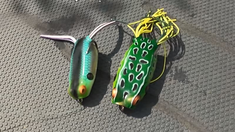Booyah Pad Crasher frog lures sitting on boat deck.