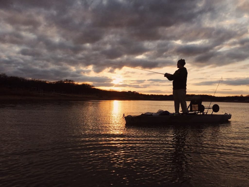 Man fishing from a kayak.