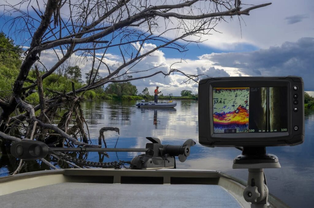 Boat on a lake with a fish finder mounted on it.