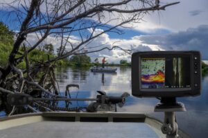 Boat on a lake with a fish finder mounted on it.