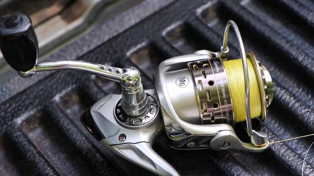 Pflueger Supreme spinning reel laying on its side