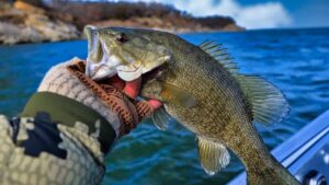 Man holding a bass on a winter day