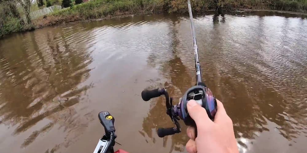 Man fishing with the Revo IKE casting reel