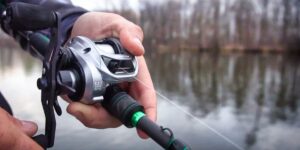 Man fishing with the Alloy M reel