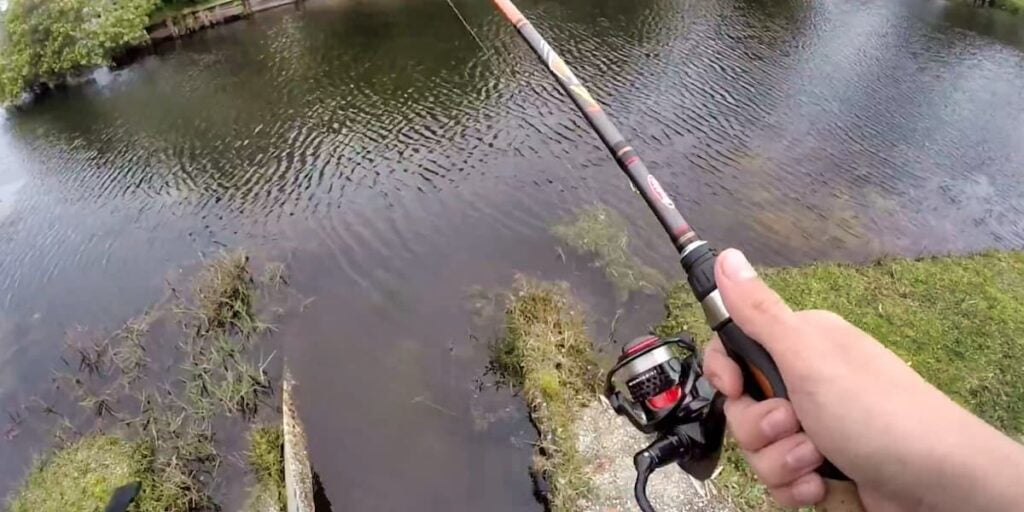 Man fishing in a pond with the Ceymar