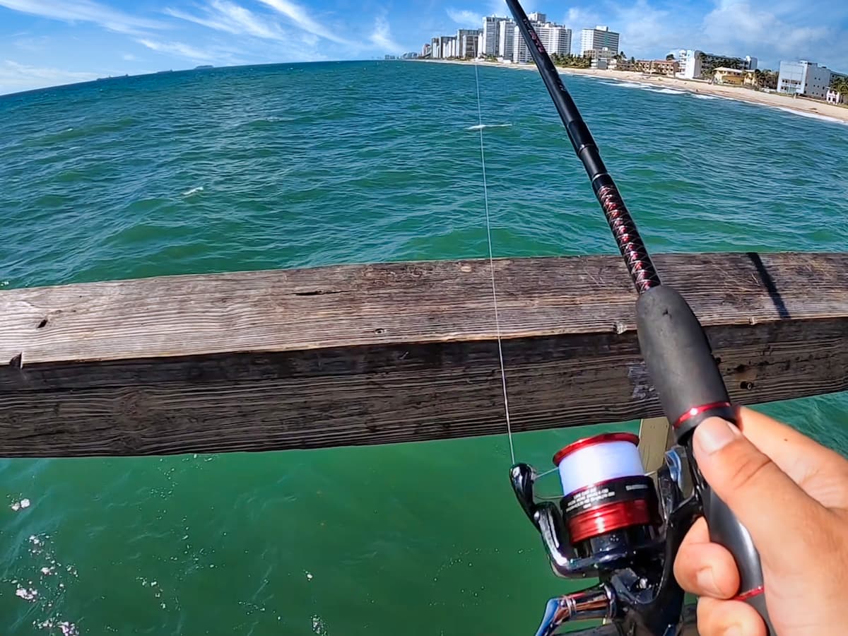 Man pier fishing with the Shimano Sienna
