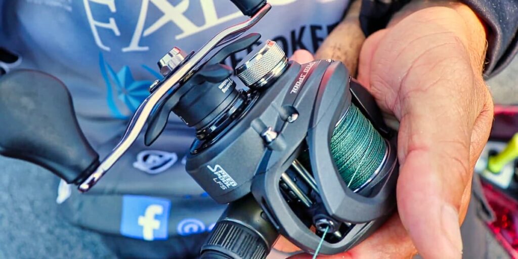 Up close shot of a man holding the Lew's Speed Spool LFS reel