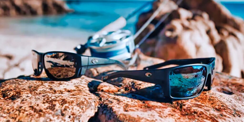 Stylish photo of the Tuna Alley sunglasses sitting on rocks
