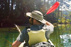 Man kayaking in the Sunday Afternoons Cruiser Hat