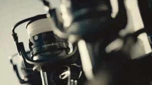 A couple of Penn Clash 2 spinning reels on rods mounted on the side of a boat.