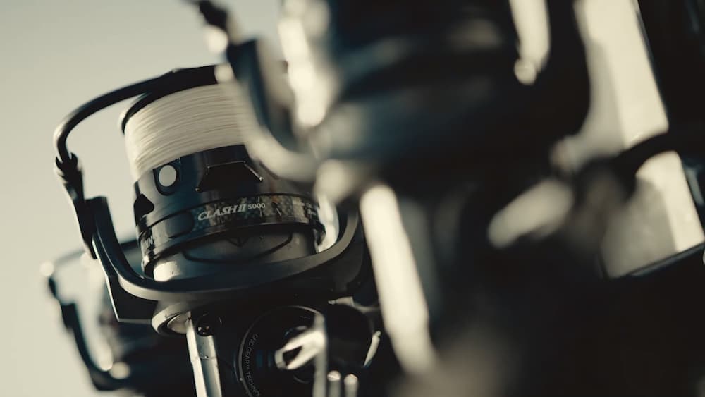 A couple of Penn Clash 2 spinning reels on rods mounted on the side of a boat.