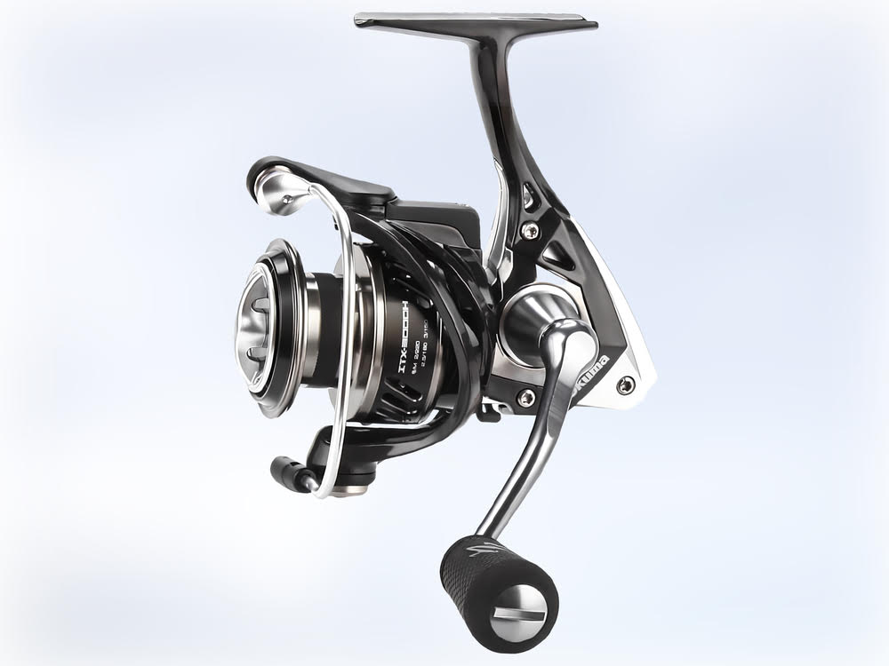 A close up of the Okuma ITX Spinning Reel on a motorcycle.