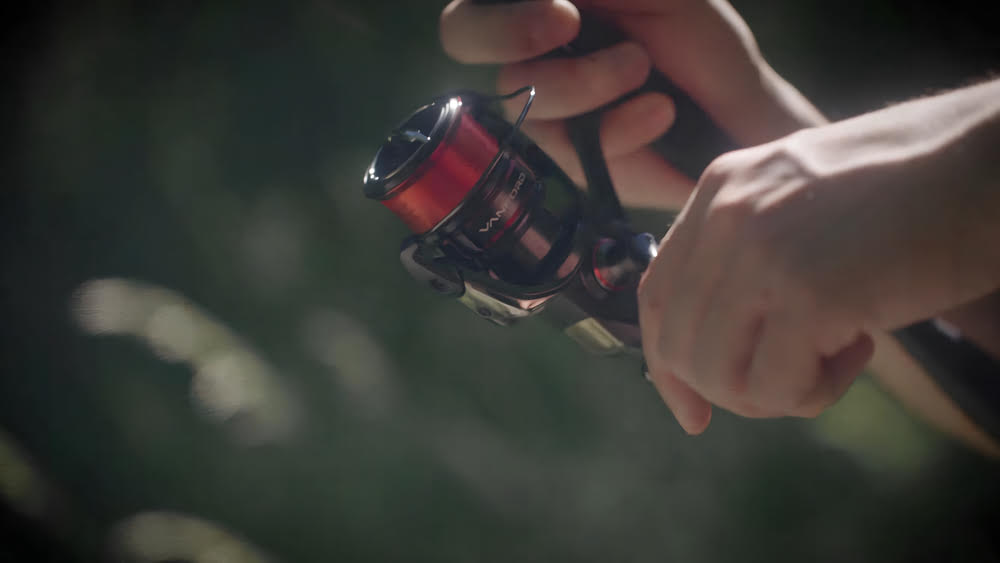 Mountain fisherman with a Shimano Vanford Spinning Reel.