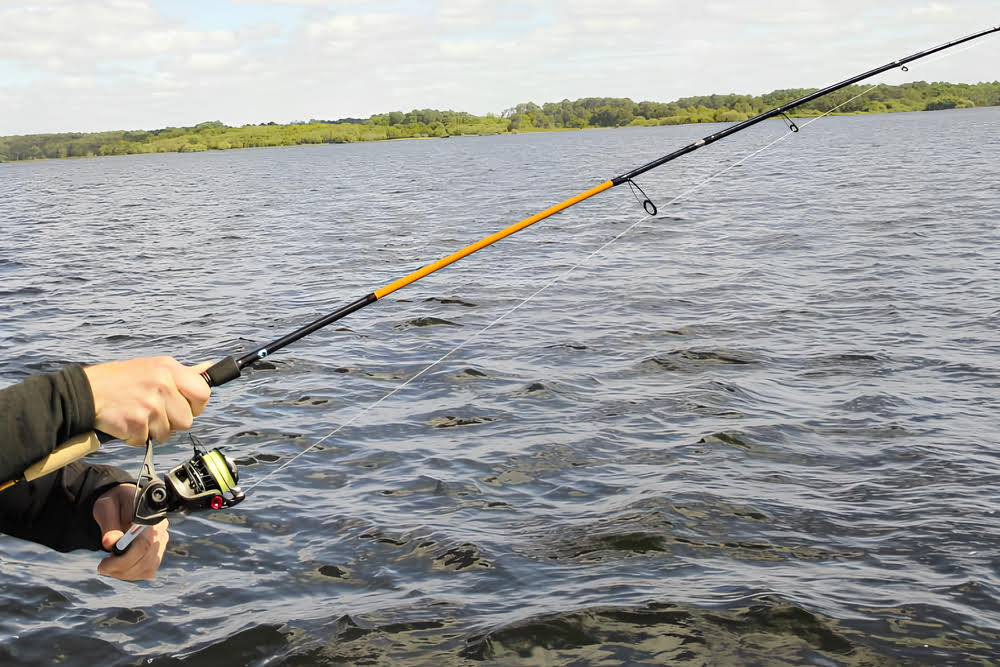 Fishing with the Quantum Smoke S3 Spinning Reel on a lake.