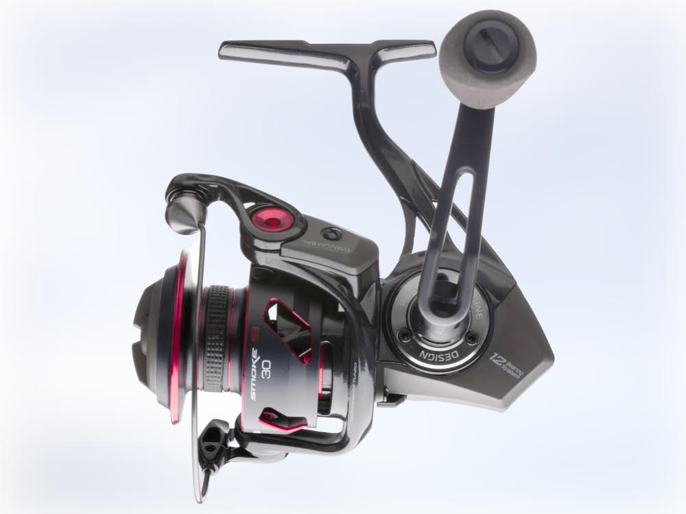 The Quantum Smoke S3 Spinning Reel on a pair of headphones.