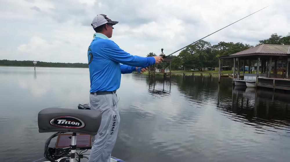 A man fishing on a lake during a cold front