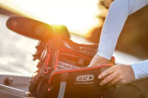 Close-up of a person holding the EGO Kryptek Tackle Backpack